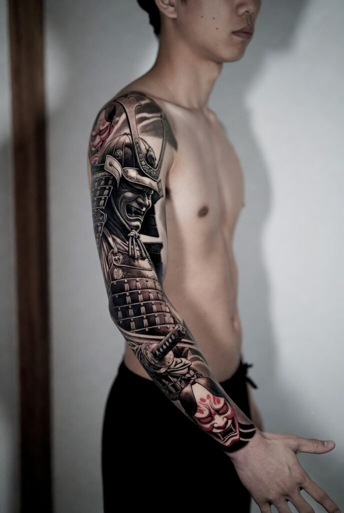 A Japanese model displays a detailed samurai tattoo on their arm in a photographic style.