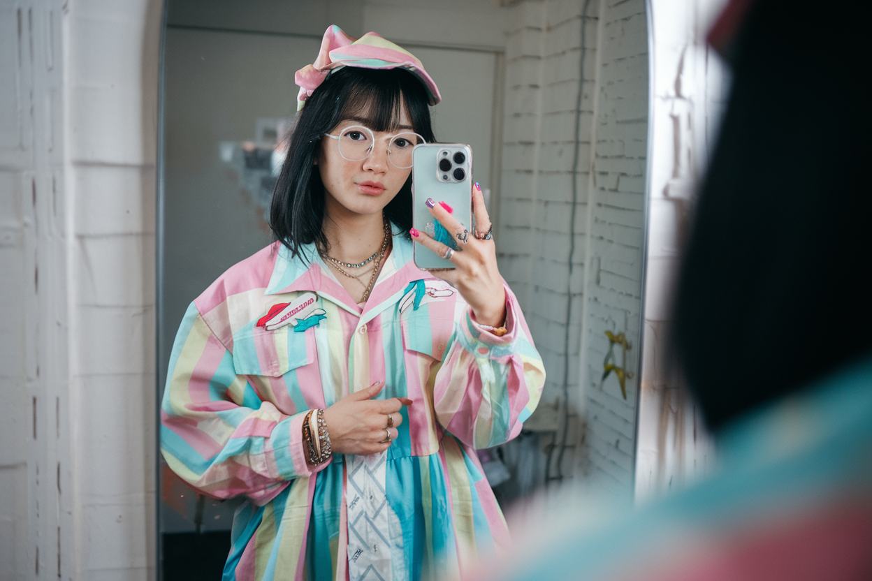 Harajuku Women Outfit Ideas: 5 Bold and Colorful Fashion Looks 2026! 1 Japanese woman taking a mirror selfie wearing a pastel-colored Harajuku outfit with bright accents and bold color play — harajuku women outfit ideas.